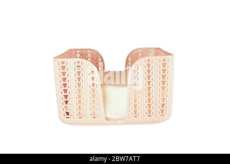 Rattan pink tissue box isolated on white - cold and flu season concept, grief, concept selective focus . Healthcare and hygiene Stock Photo