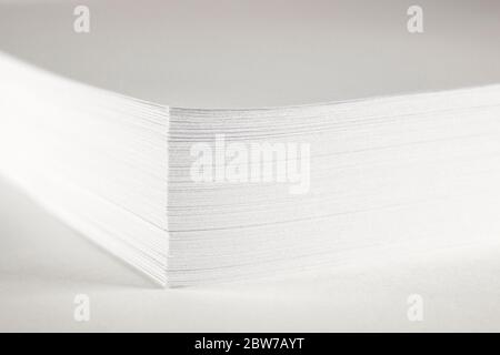 Close up of stack of papers on white background. Office: Pile of Paper Stock Photo
