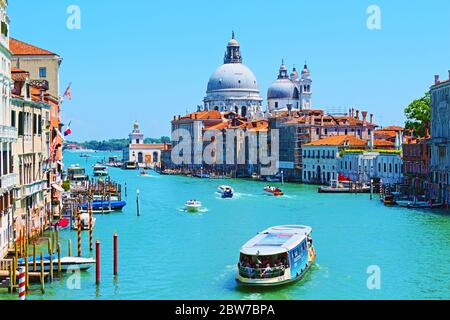 Historic buildings along Grand Canal-Canale Grande Chiesa di Santa Maria della Salute magnificent church seen from Accademia Bridge,Venice,June 2016 Stock Photo