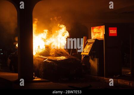 Minneapolis USA. 29th May 2020. A car burns in front of a Wells