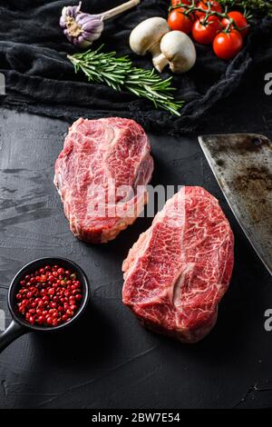Uncuttable Meat focus wagyu beef butcher cut raw meat with a knife at table in the ...
