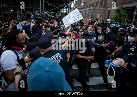 New York, USA. 29th May, 2020. Protesters confront police in New York, the United States, May 29, 2020. New Yorkers continued to protest over the death of George Floyd as hundreds of people took to the street in Manhattan on Friday to express their anger toward police brutality and racism. Credit: Michael Nagle/Xinhua/Alamy Live News Stock Photo