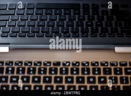 Closeup of laptop keyboard. Reflection of keys in laptop screen. Stock Photo
