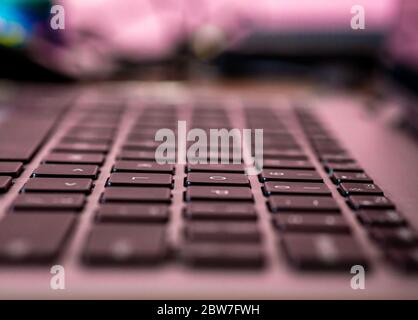 Closeup of laptop keyboard, Black keys on silver laptop. Stock Photo