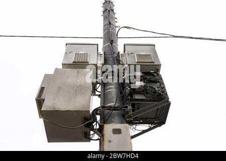 5g tower close-up on a background of gray nondescript sky Stock Photo