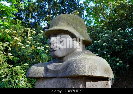Fragment of a partly destroyed historic solider memorial by the sculptor Jupp Rübsam (1896 - 1976). Stock Photo