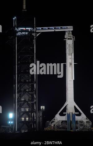 Cape Canaveral, United States of America. 29 May, 2020. The SpaceX Falcon 9 rocket carrying the Crew Dragon spacecraft at Launch Complex 39A at night at the Kennedy Space Center May 29, 2020 in Cape Canaveral, Florida. The NASA SpaceX Demo-2 mission will make a second attempt at launch May 30th as the first commercial launch carrying astronauts to the International Space Station. Credit: Bill Ingalls/NASA/Alamy Live News Stock Photo