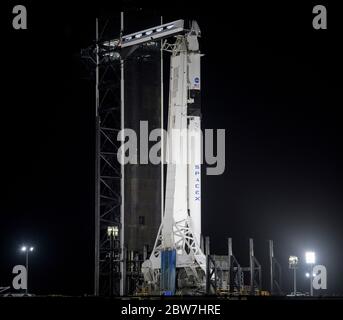 Cape Canaveral, United States of America. 29 May, 2020. The SpaceX Falcon 9 rocket carrying the Crew Dragon spacecraft at Launch Complex 39A at night at the Kennedy Space Center May 29, 2020 in Cape Canaveral, Florida. The NASA SpaceX Demo-2 mission will make a second attempt at launch May 30th as the first commercial launch carrying astronauts to the International Space Station. Credit: Bill Ingalls/NASA/Alamy Live News Stock Photo