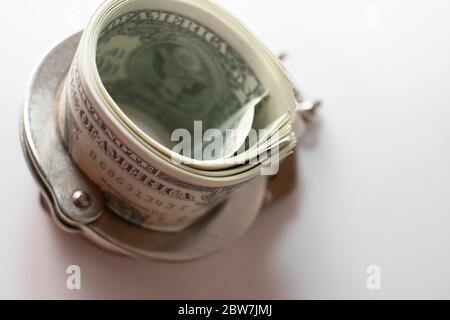 Dollar Bills With Handcuffs on white background Stock Photo