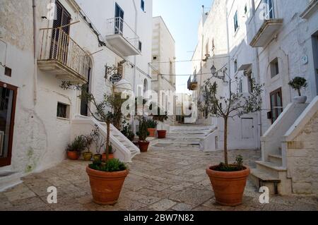 OSTUNI, APULIA, ITALY - MARCH 28th, 2018: Typical street of Ostuni, La Citta Bianca. Ostuni. Apulia, Italy Stock Photo