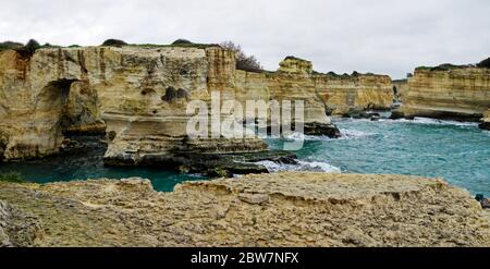 Picturesque landscape with cliffs, rocky arch and stacks faraglioni, at Torre Sant Andrea, Salento sea coast, Puglia, Italy Stock Photo