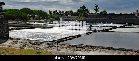 TAMARIN/MAURITIUS - AUGUST 24, 2018: Tamarin Salt Pans is a popular tourist attraction with the square brick clay basins.This place produces artisan s Stock Photo