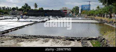 TAMARIN/MAURITIUS - AUGUST 24, 2018: Tamarin Salt Pans is a popular tourist attraction with the square brick clay basins.This place produces artisan s Stock Photo