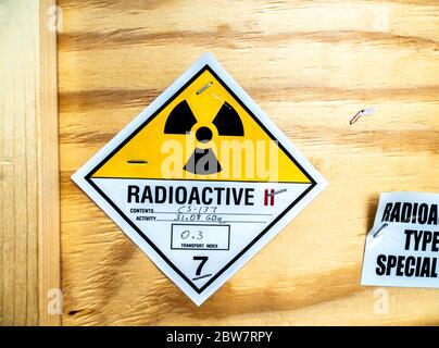 Radioactive material warning label beside the transportation standard wooden package Stock Photo