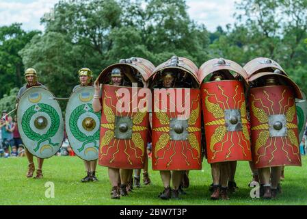 St Albans, England: The Ermine Street Guard reenact Roman battles at a new Roman Festival held on the same day as the Alban Pilgrimage 2019. Stock Photo