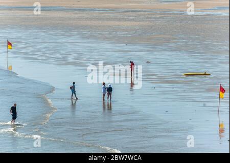 Inchydoney, West Cork, Ireland. 30th May, 2020. People flocked to  Inchydoney Beach today amidst the hot weather. This comes after four  teenagers were rescued at Inchydoney on Thursday last. The weather is