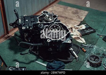 Disassembled fast motorcycle engine with visible clutch. Sixteen valves and four cylinder.