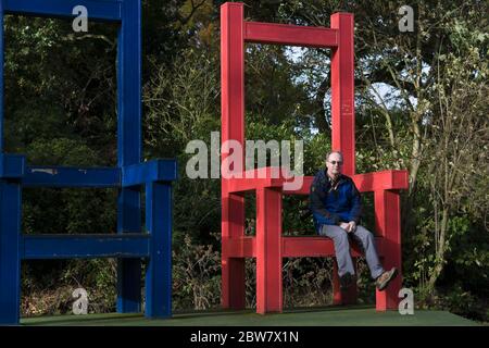 Small man (?) in a large chair, Vogrie Country Park, Midlothian, Scotland Stock Photo