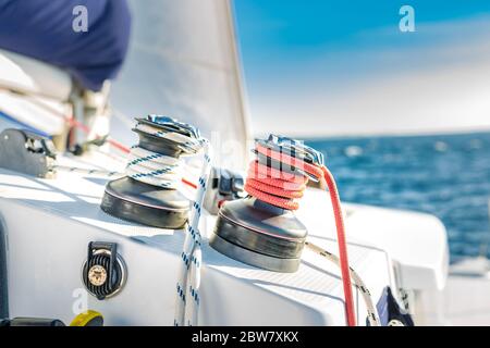 Sailboat winch and rope yacht detail. Yachting, winch with ropes on a sailboat while sailing Stock Photo