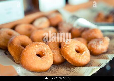 Sweet pieces of sugar doughnuts with cinnamon sugar. Sweet pieces of sugar doughnuts with cinnamon sugar Stock Photo