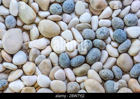 Abstract smooth round pebbles sea texture background. Abstract nature pebbles background. Blue pebbles texture Stock Photo