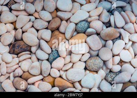 Abstract smooth round pebbles sea texture background. Abstract nature pebbles background. Blue pebbles texture Stock Photo