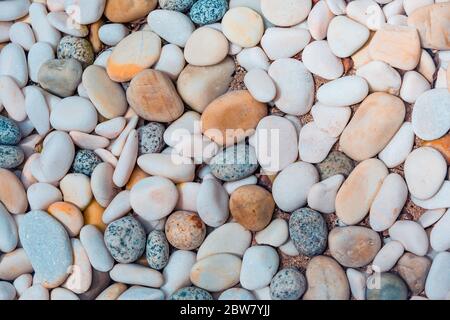 Abstract smooth round pebbles sea texture background. Abstract nature pebbles background. Blue pebbles texture Stock Photo