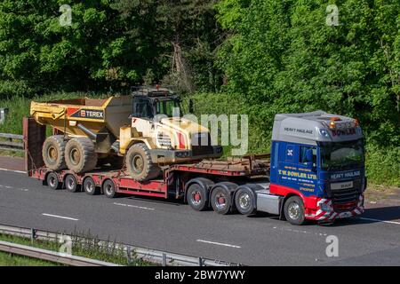 T W Bowler Ltd; Haulage delivery trucks, lorry, transportation, Terex ta30 dumpers truck, cargo carrier, DAF vehicle, European commercial transport industry HGV, M6 at Manchester, UK Stock Photo