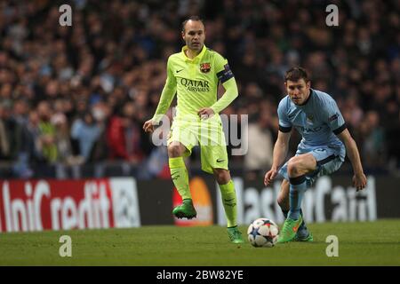MANCHESTER, ENGLAND - Andres Iniesta of Barcelona and James Milner of Manchester City during the UEFA Champions League Round of 16 1st Leg between Manchester City and FC Barcelona at the Etihad Stadium, Manchester on Tuesday 24th February 2015 (Credit: Mark Fletcher | MI News) Stock Photo