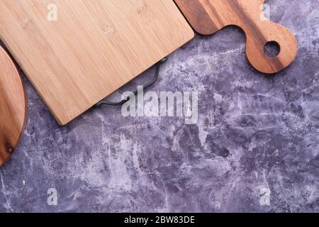Top view of wooden chopping boards on gray background . Stock Photo