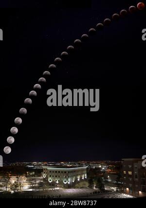 January 2019 Lunar Eclipse Image Composite of Eclipse with Stars, Moon, and Buildings near Denver, Colorado Stock Photo