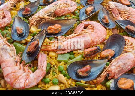 Traditional Spanish Paella with seafood vegetable meat, and rice Stock Photo