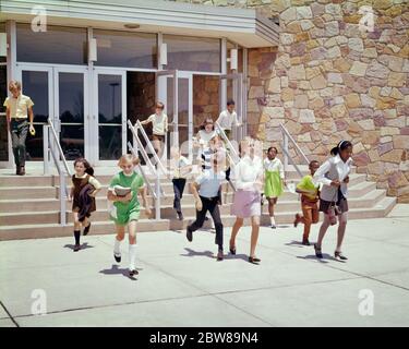 1960s 1970s GROUP OF ETHNICALLY DIVERSE KIDS RUNNING OUT OF SCHOOL BUILDING AT END OF DAY OR END OF SCHOOL YEAR SUMMER BREAK - ks5968 HAR001 HARS DIVERSE COMIC PLEASED JOY LIFESTYLE SATISFACTION FEMALES HEALTHINESS COPY SPACE FRIENDSHIP FULL-LENGTH END INSPIRATION MALES RELEASED CONFIDENCE BREAK FREEDOM SCHOOLS GRADE HUMOROUS HAPPINESS CHEERFUL HIGH ANGLE AFRICAN-AMERICANS AFRICAN-AMERICAN EXTERIOR RECREATION BLACK ETHNICITY COMICAL END OF DAY PRIMARY SMILES CONNECTION CONCEPTUAL COMEDY JOYFUL STYLISH OR COOPERATION ETHNICALLY GRADE SCHOOL GROWTH JUVENILES PRE-TEEN PRE-TEEN GIRL Stock Photo