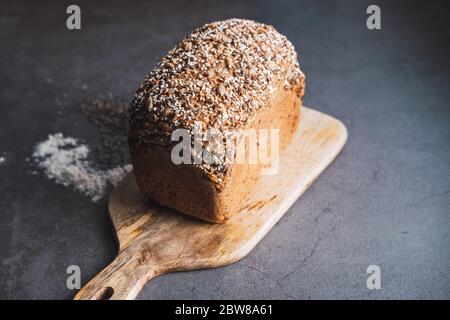 Rustic loaf of bread with seeds as chia and sunflower. Stock Photo