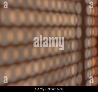 Abstract background. Shadows on the wall from the holes in the blinds Stock Photo