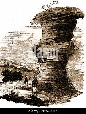 The Hemlock Stone/ Himlack Stone , Stapleford Hill (Bramcote Hills), near Stapleford, Nottinghamshire, England as it was in 1842.The stone is now protected by an iron fence and the stack is  little changed, though wind and weather erosion continues. The stone is mentioned in D.H. Lawrence's novel Sons and Lovers and  an annual free festival, the Hemlock Happening, is held for one day  each June. Stock Photo