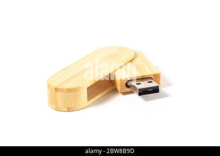 USB flash drive wooden of bamboo casing on a white background isolate Stock Photo