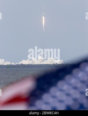 Cape Canaveral, USA. 30th May, 2020. SpaceX Falcon 9 rocket carrying the Crew Dragon spacecraft with two astronauts takes off from NASA's Kennedy Space Center in Cape Canaveral of Florida, the United States, on May 30, 2020. NASA and SpaceX launched Crew Dragon spacecraft from NASA's Kennedy Space Center in Florida on Saturday, carrying two American astronauts to the International Space Station (ISS). Credit: Ting Shen/Xinhua/Alamy Live News Stock Photo