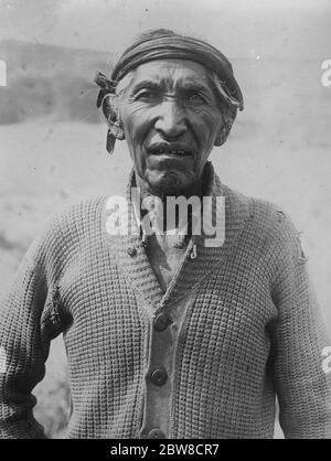 Indian charged with murder of 14 gold miners in 8 days . ' Sulky Bull ' a Navaho Indian who is under lock and key at Tombstone , Arizona , charged with the murder of fourteen gold miners , whom it is alleged in the course of eight days , he waylaid and strangled one by one . 26 August 1927 Stock Photo