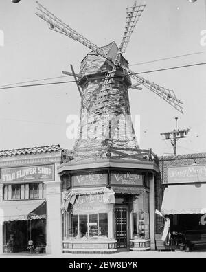 In a city of Nightmare houses . A new picture from Los Angeles showing a Van de Kamp ' s Holland - Dutch bakery representing a windmill . 16 May 1928 Stock Photo