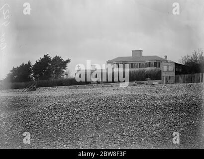 Craigwell House , Aldwick , Sussex . a view from the sea front showing a policeman on guard . Stock Photo