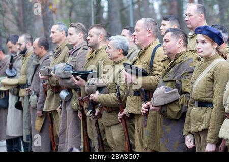 Vorzel, Ukraine - November 03, 2019: People in the form of Red Army soldiers stand in formation with weapons on the historical reconstruction of the a Stock Photo