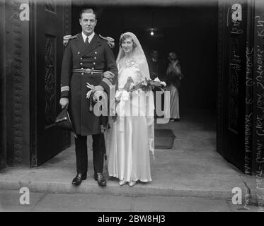 Naval officer ' s wedding . The wedding at St Pancras Parish Church between Instr Lieut Commander Cyril Tom Suthons , Royal Navy and Miss Margaret ( Peggy ) Ellenor Clarke . The bride and bridegroom . 31 October 1931 Stock Photo