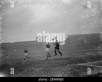 Millwall football club versus Notts County Football Club . Two players compete for the ball . 1936 Stock Photo