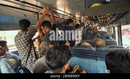 Agra, India - December 12, 2018: Indian city bus with people. Stock Photo