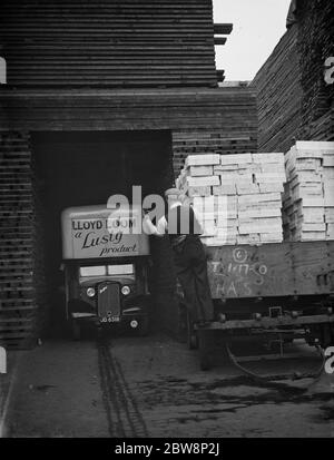 The forecourt of Lloyd loom , lusty furniture produce factory , The Bedford lorrys leaving on a job . 1938 Stock Photo