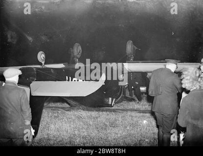 The Biplane belonging to Amy Johnson , the famous aviatrix , seen here upside down after crash landing in a field near Chelsfield , Kent . Mrs Johnson survived the crash but suffered a fractured nose and a dislocated shoulder . 1936 Stock Photo