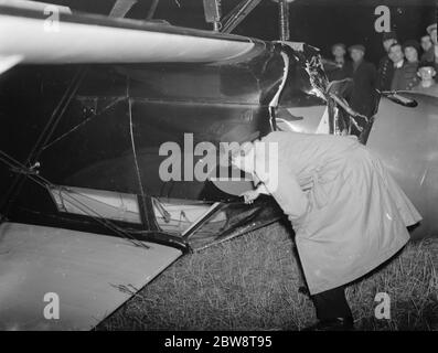 The Biplane belonging to Amy Johnson , the famous aviatrix , seen here upside down after crash landing in a field near Chelsfield , Kent . Mrs Johnson survived the crash but suffered a fractured nose and a dislocated shoulder . 1936 Stock Photo