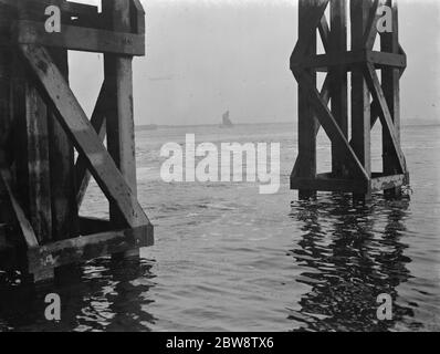 The construction of the Dartford Tunnel , where recently a pilot tunnel was completed . Air bubbles are appearing on the river Thames above where the tunneling is taking place . 1938 Stock Photo