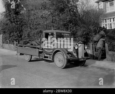 Coal delivery by one of the coal vans from T Denness , Coal and Coke Merchants in Chislehurst , Kent . 1936 . Stock Photo